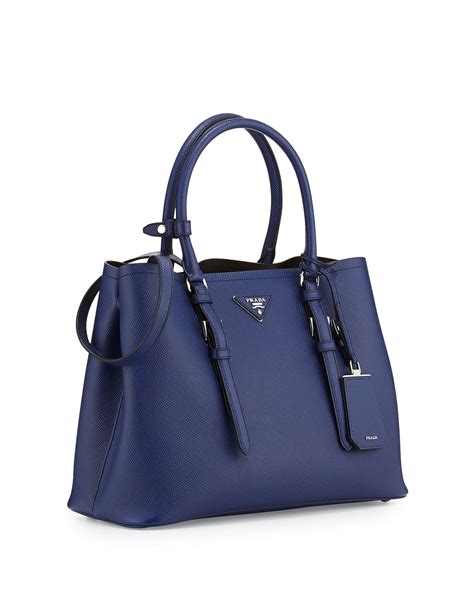 dark blue prada bag.